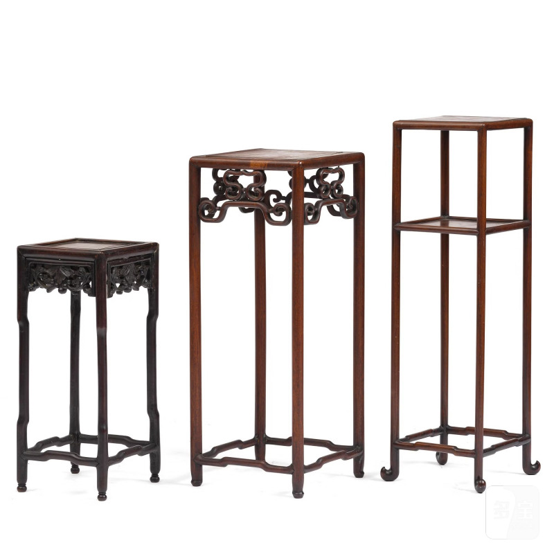 A group of three hardwood tall tables,